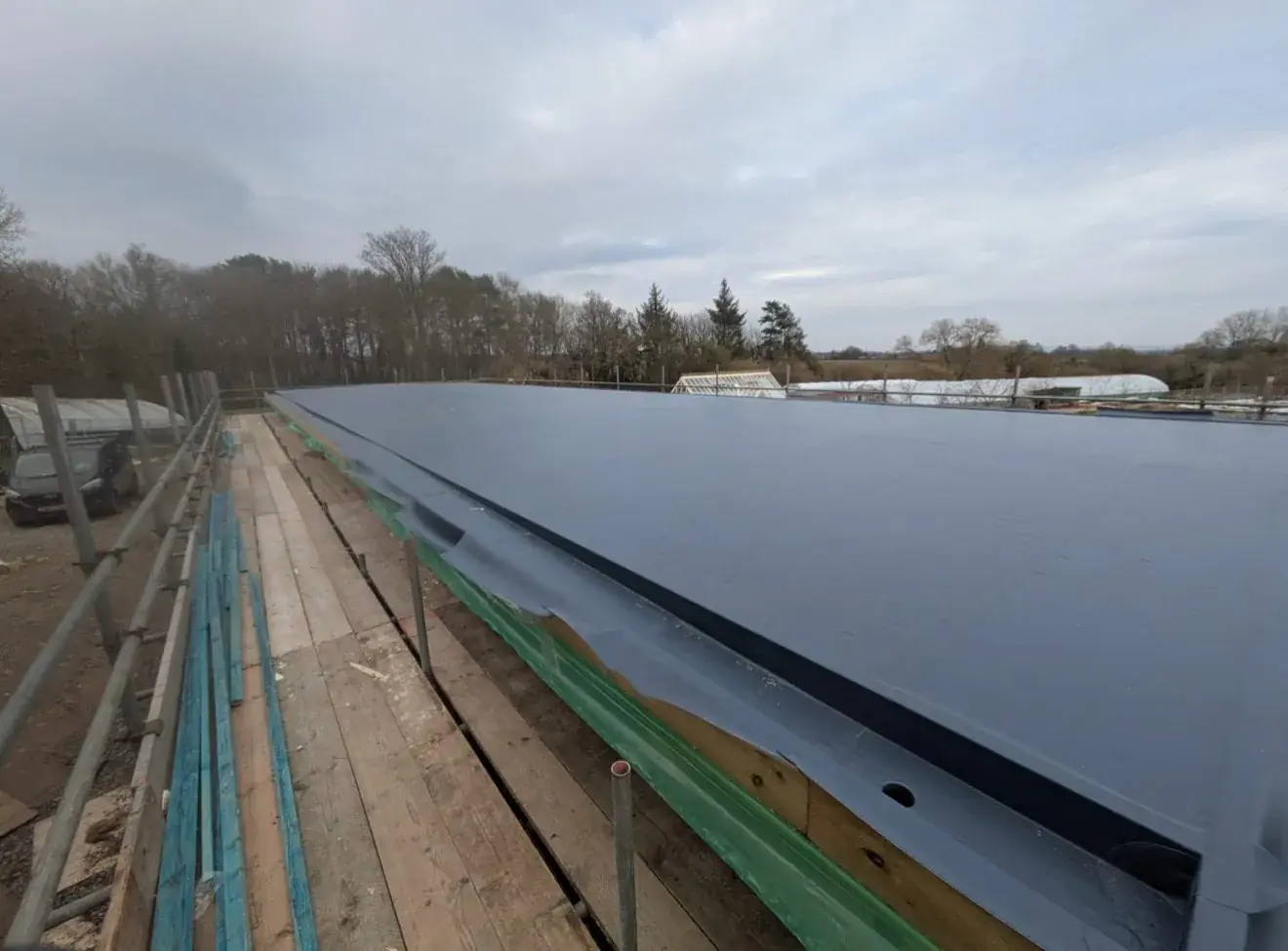 Single ply membrane across a long domestic roof